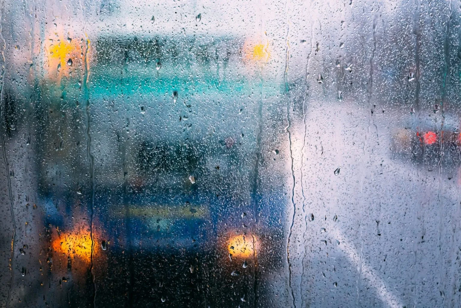 Drops Of Rain On Glass On Glass Background